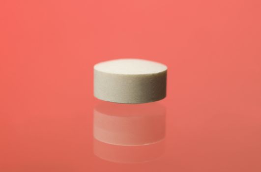 Pill toward red background