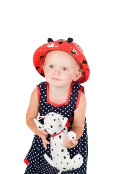 Shot of little girl in polka dot dress in studio