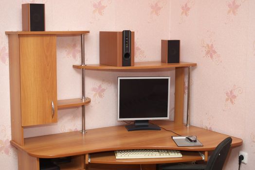 photo of the computer desk with monitor and row