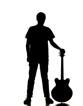 silhouette of a man playing guitar