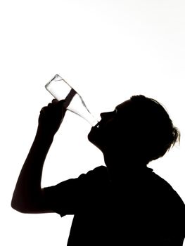 silhouette of a man drinking