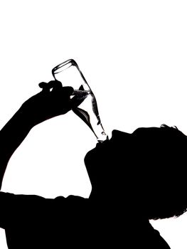 silhouette of a man drinking