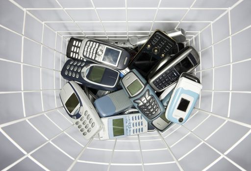 Cellphones in a paper basket