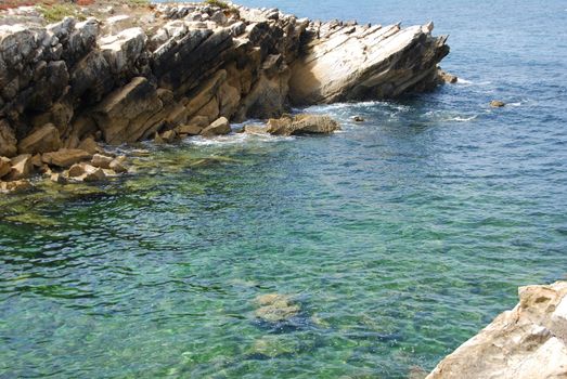 beautiful green seascape between huge rocks