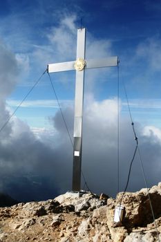 Holy cross on peak mountain