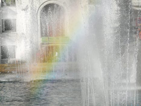 Rainbow sheaf growing in urban fountain