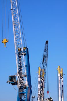 Cranes agains a blue sky