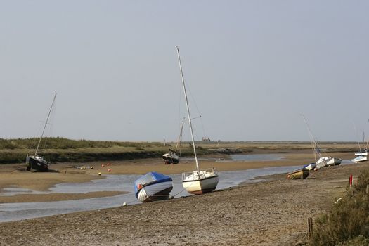 boats awaiting the tide as it will come into the estuary
