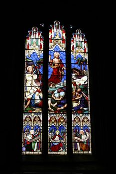 stain glass window telling a story from the bible