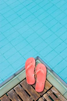 Red flip flops by the pool.