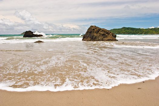 Photo of a wide wave at the beach on the Pacific Coast of Costa Rica.