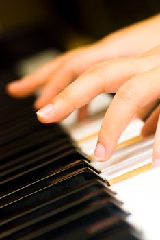 Fingers captured as they played a tune on the piano