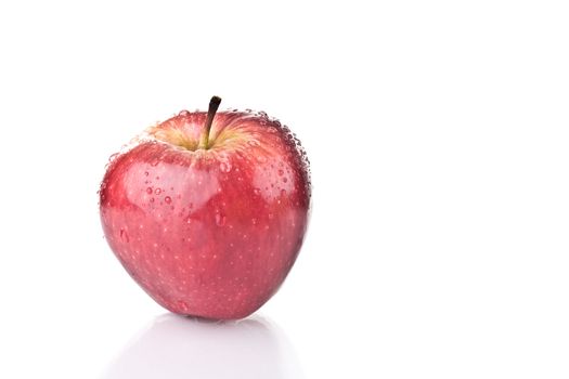 Fresh red apple over white background.