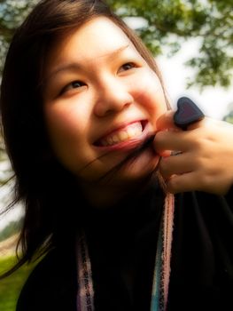 Teenager; Girl falling in love expression with a grin