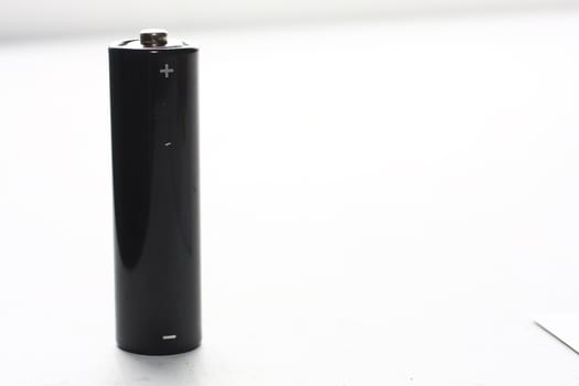 Black AA battery on white background