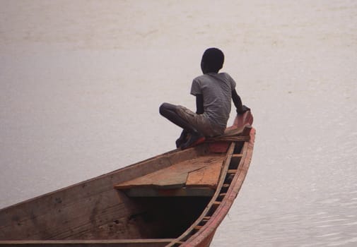 Child on a boat at Sengal river