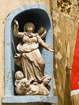 Medieval niche and statue in the old city of Rabat in Malta