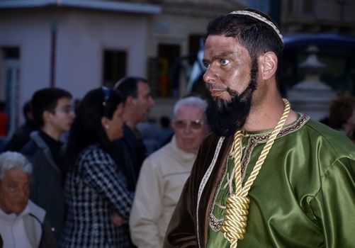 Various Biblical figures from the passion of the Christ during the good Friday procession in Luqa in Malta  