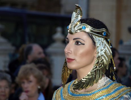 Woman dressed up as Queen Cleopatra during reenactment of Biblical times  