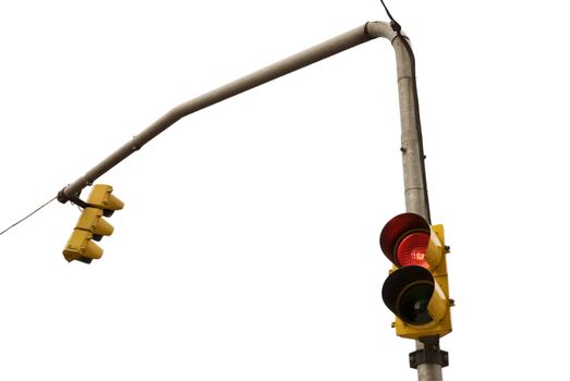 Low angle shot of odd pair connected traffic lights facing opposite directions, one missing the green light.