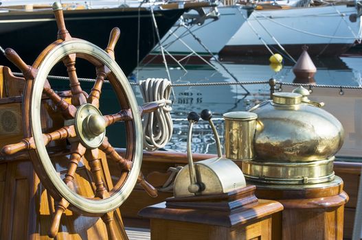 Detail of steering wheel and tools on a vessel