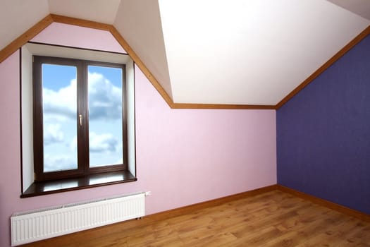 
Room with a window in which the sky is visible