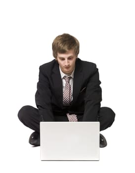 Man sitting on the floor with a computer