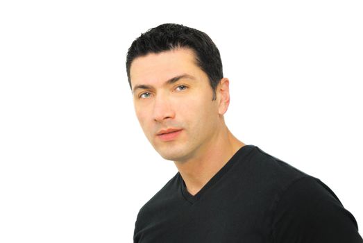 A portrait of a serious man in his thirties wearing black t-shirt over white background.