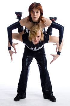 two dancers in same costumes on white
