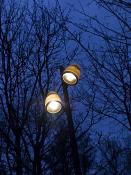 Street lighting towards a blue sky