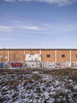 Brickwall with graffiti on