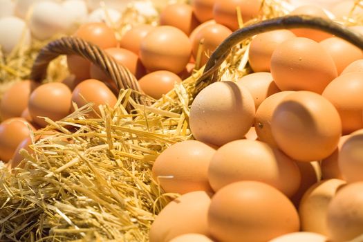 Two baskets of eggs on a market stall.