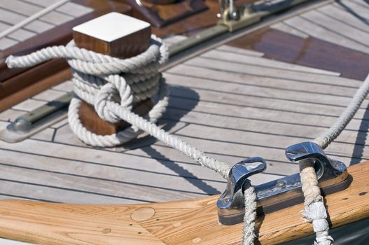 Close-up of a moored boat with bitt and ropes