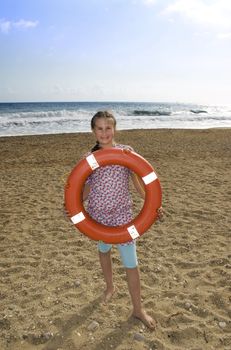 Girl with ring-buoy at sea 