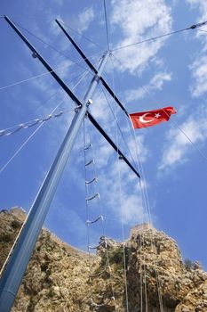 Turkey's flag on mast of pleasure boat.