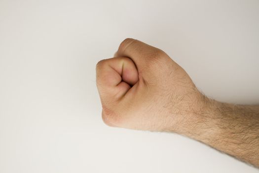 Powerful fist on white background.