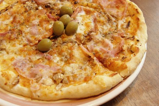 Tasty gourmet pizza with olives