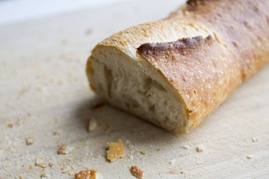 Cut in half Italian Bread. Shallow Depth of field on the cutting board.