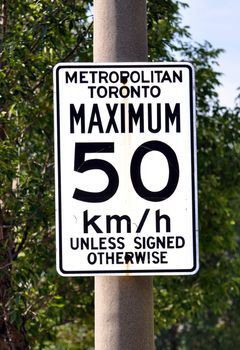 Traffic sign indicating speed limit in the city of Toronto, Canada.