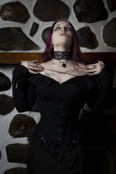 young woman dress in black theme goth fashion