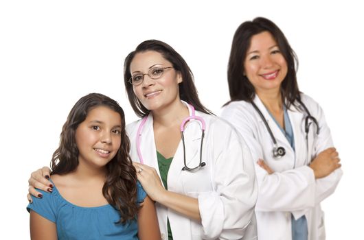 Pretty Hispanic Female Doctor with Child Patient and Colleague Behind Isolated on a White Background.