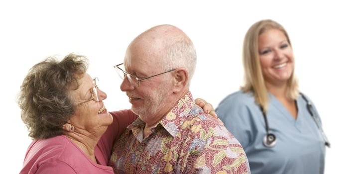 Happy Loving Senior Couple with Smiling Medical Doctor or Nurse Behind Isolated on a White Background.