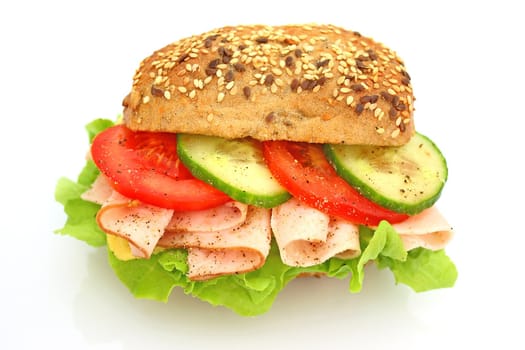 Fresh sandwich with ham and cheese and vegetables