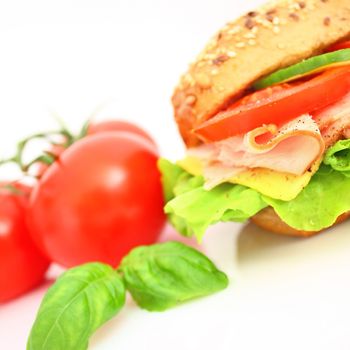 Fresh sandwich with ham and cheese and vegetables