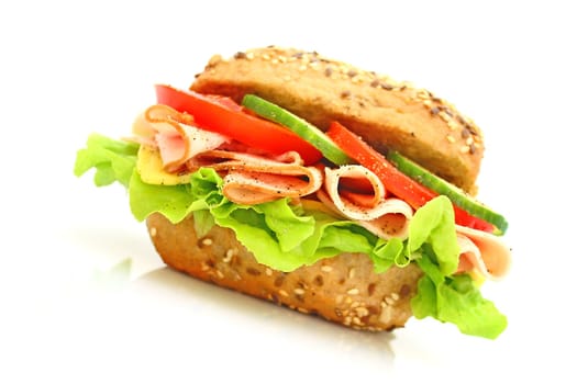 Fresh sandwich with ham and cheese and vegetables