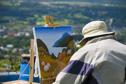 A painter admiring the meadows in Quebec