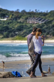 A couple watching the new pictures in Byron Bay, Australia