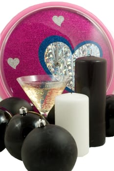 christmas balls and champagne with colorful clock at midnight on white