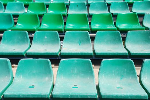 close up of green seats on a beach stadium