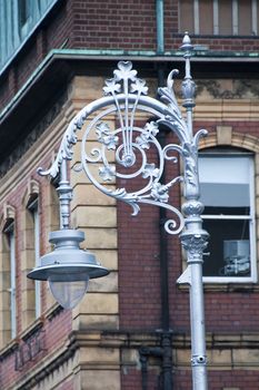The contrast of a street light and a Dublin building